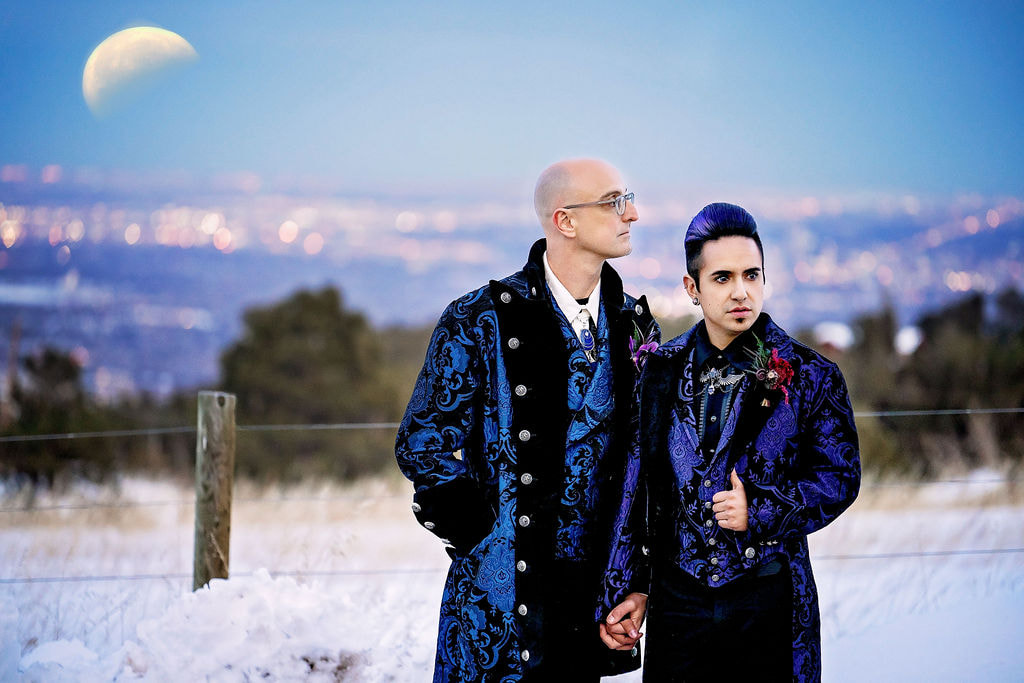 two grooms with moon and snow