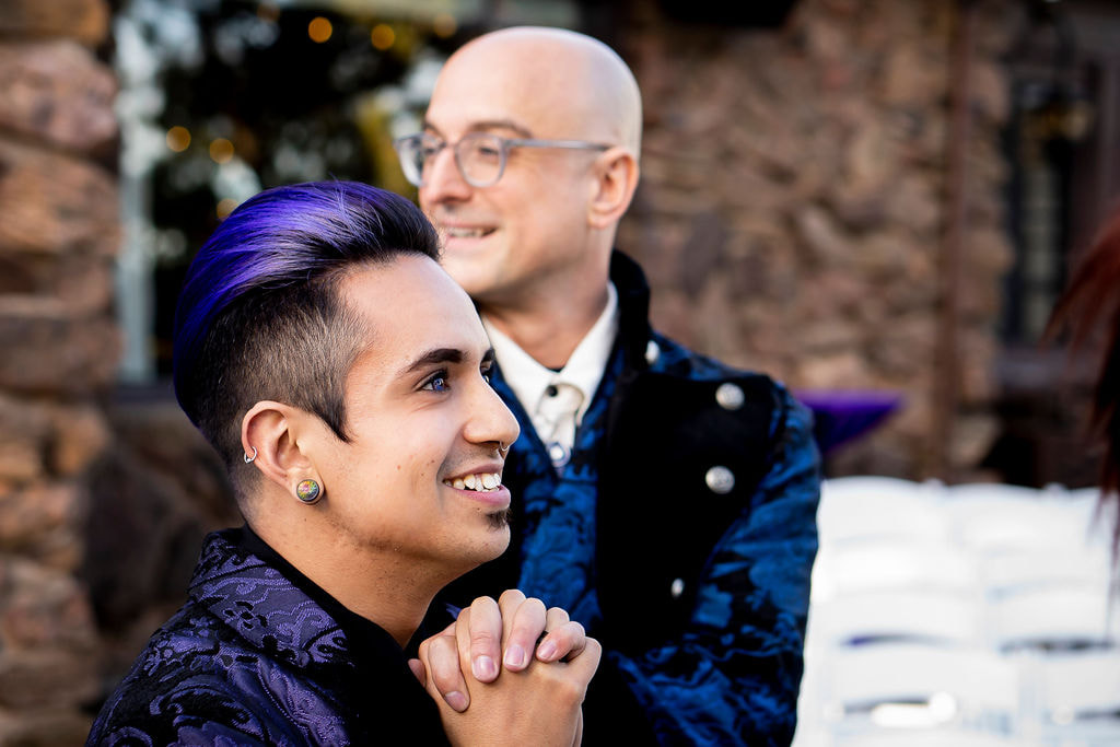 gay wedding groom with purple hair