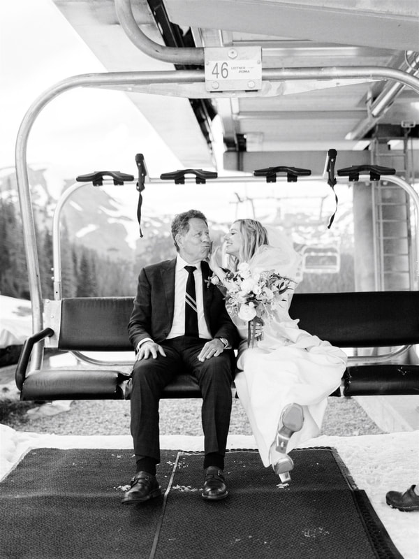 bride and dad on ski lift