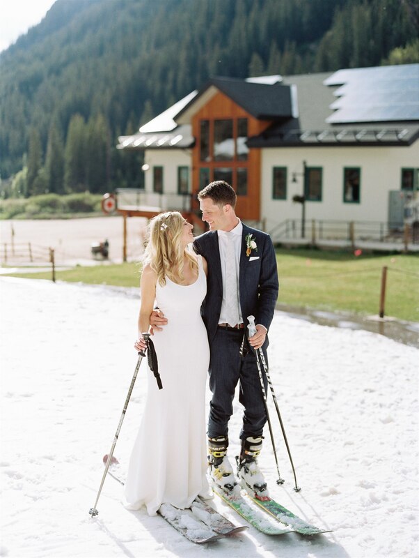 bride and groom skiing arapahoe basin
