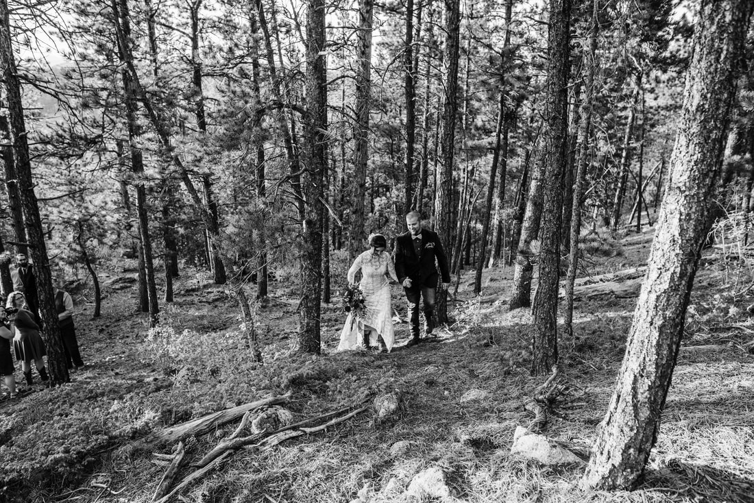 bride and groom in forest mountain wedding elopement