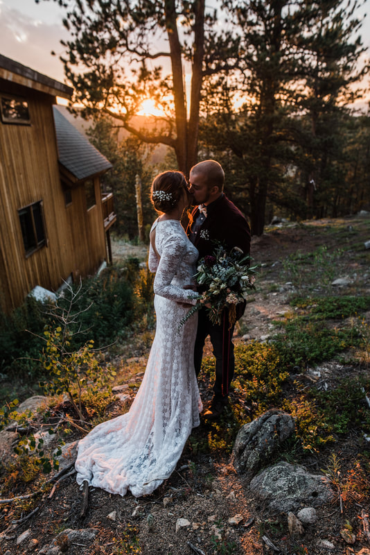 bride and groom kiss mountain elopement sunset