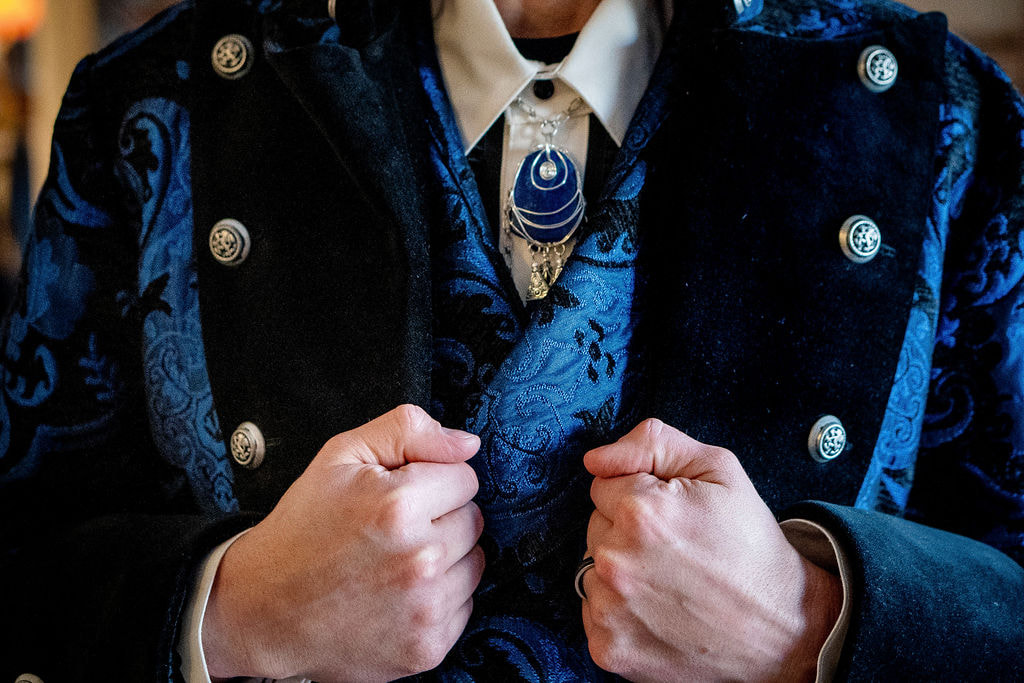 groom in blue brocade jacket