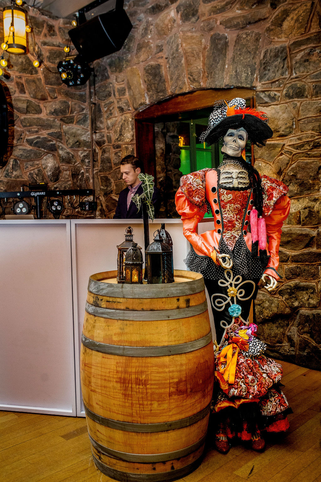 wine barrell decor and dia de los muertos lady skeleton prop