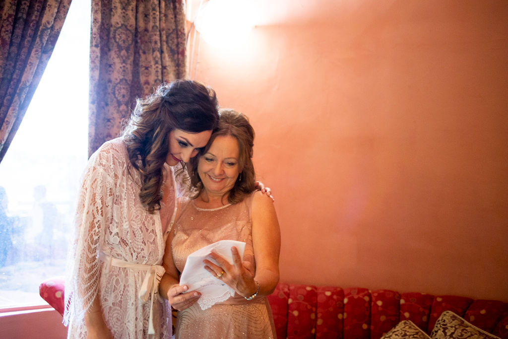 bride and mom giving gifts before ceremony