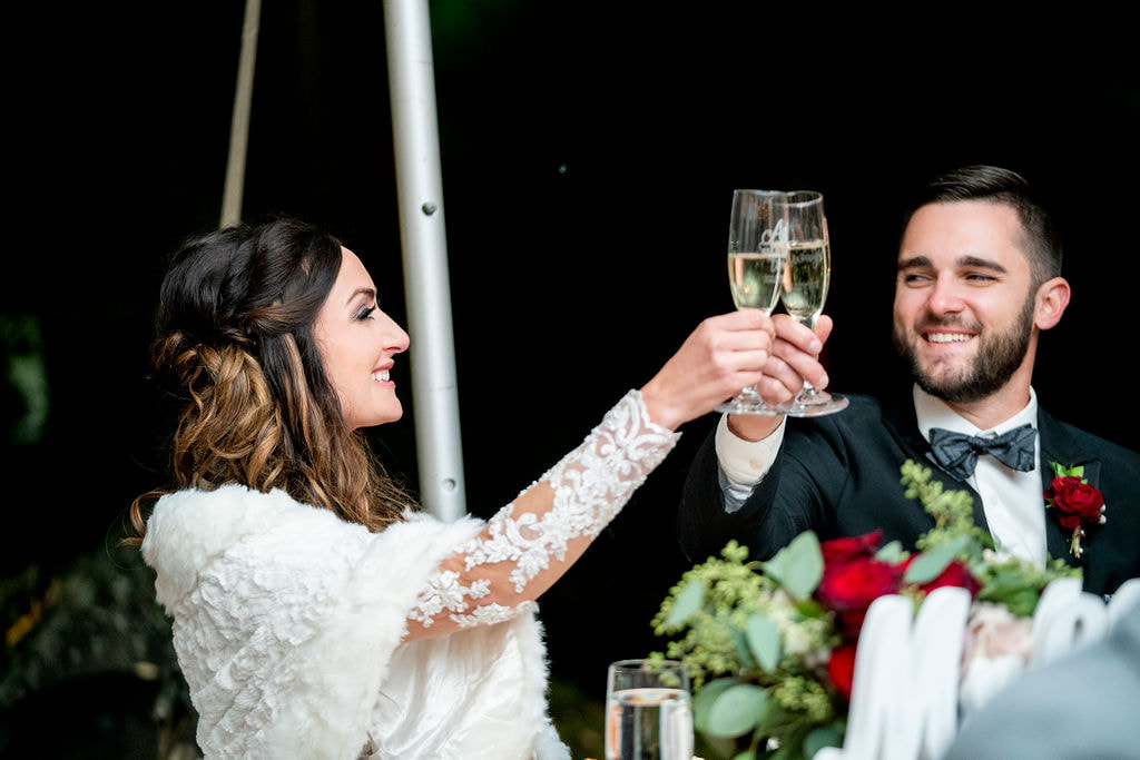 bride and groom toasting champagne at romantic dunafon castle wedding in colorado