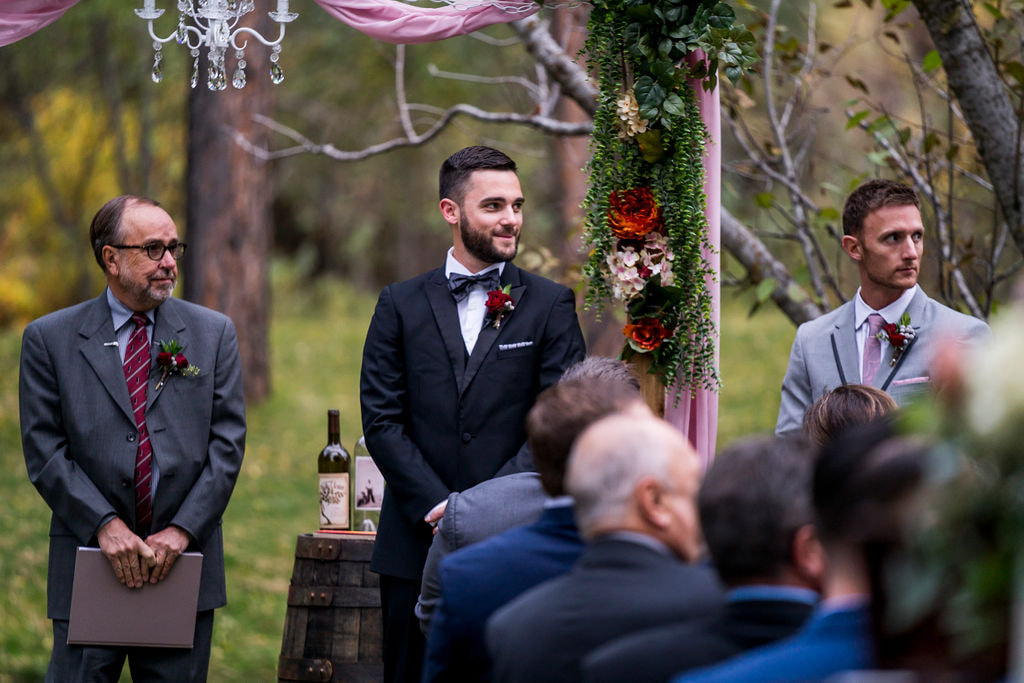 groom watching for bride to walk down the aisle