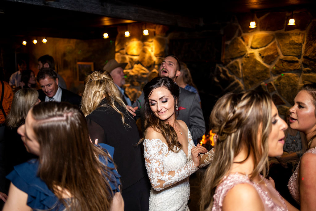 bride dancing in group of people at dunafon castle wedding reception